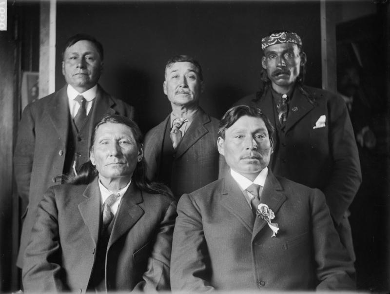 Photo of William Penn (Cherokee), His Shield (Yanktonai), Levi Big Eagle (Yanktonai), Bear Ghost (Yanktonai) and Black Moustache (Sisseton).